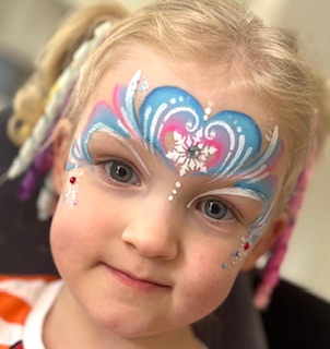Girl with Elsa Frozen face paint in Codsall